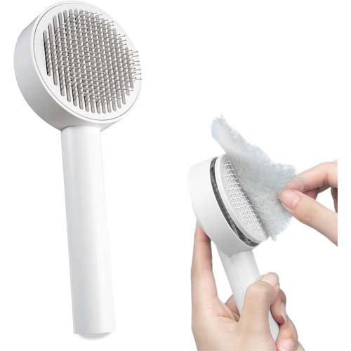 Brosse autonettoyante blanche PiuPet pour chat avec bouton d'éjection des poils et picots protégés.
